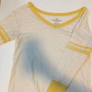 Yellow and white top.